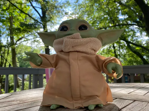 Baby Yoda toy on a table