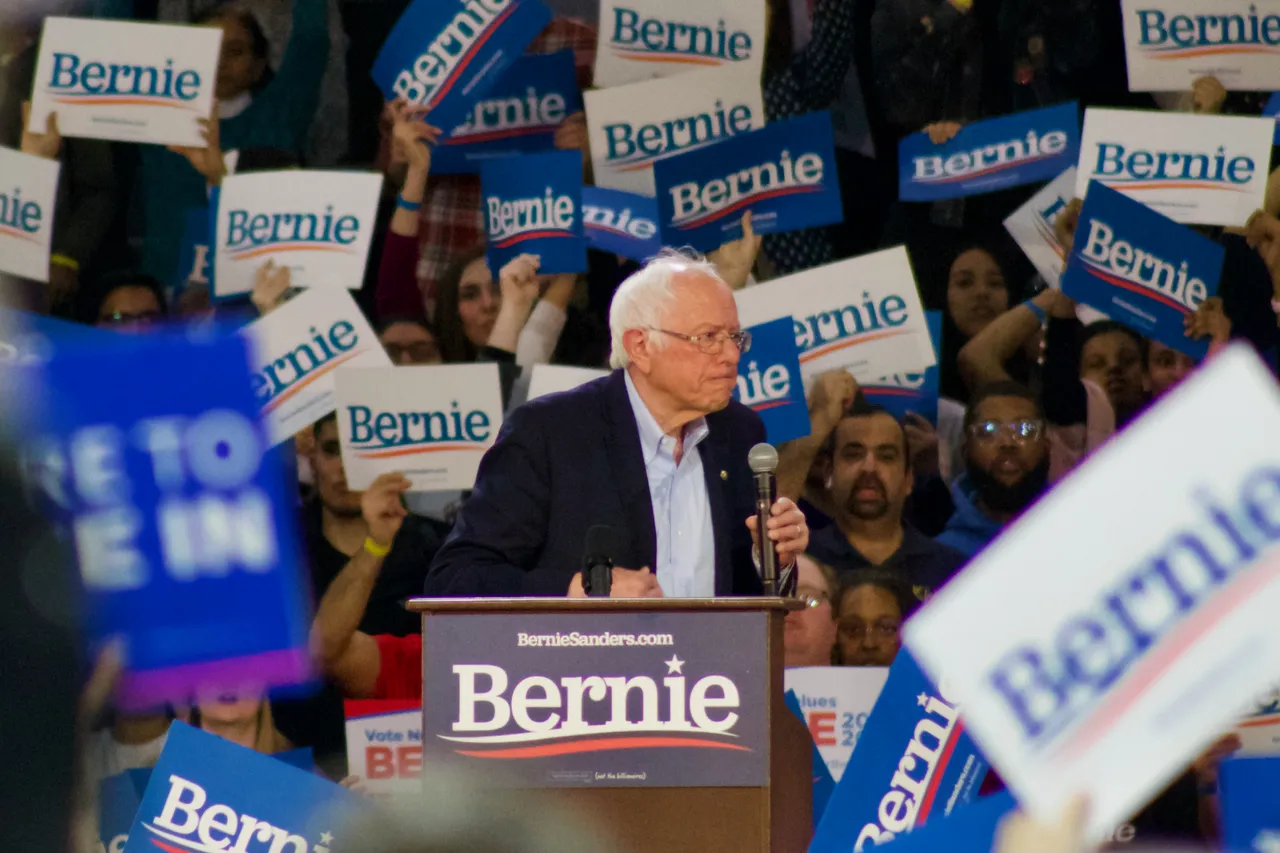 Bernie Sanders speaking at a large rally