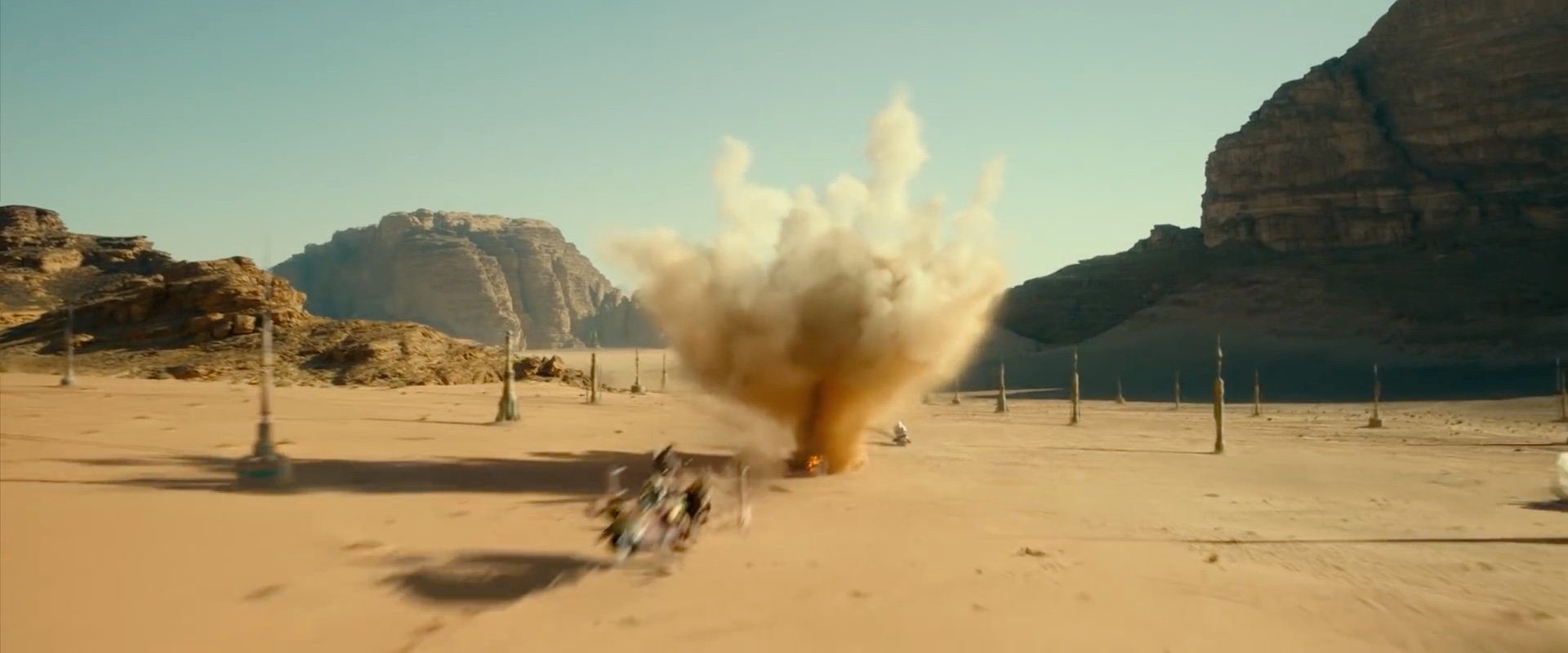 Jetpack-wearing stormtroopers chasing a speeder across a desert landscape